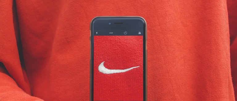 showing nike logo on a pullover through the phone
