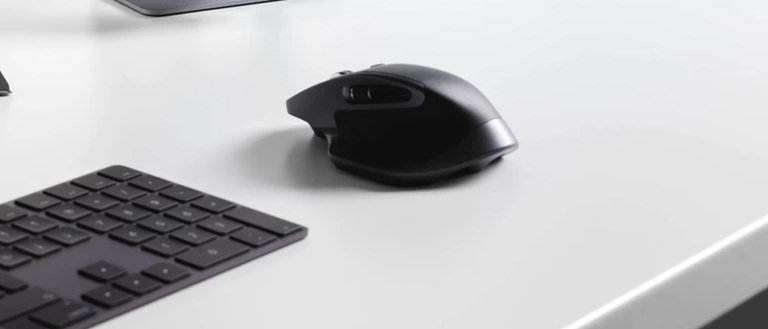 logitech mx master 2 on a white table